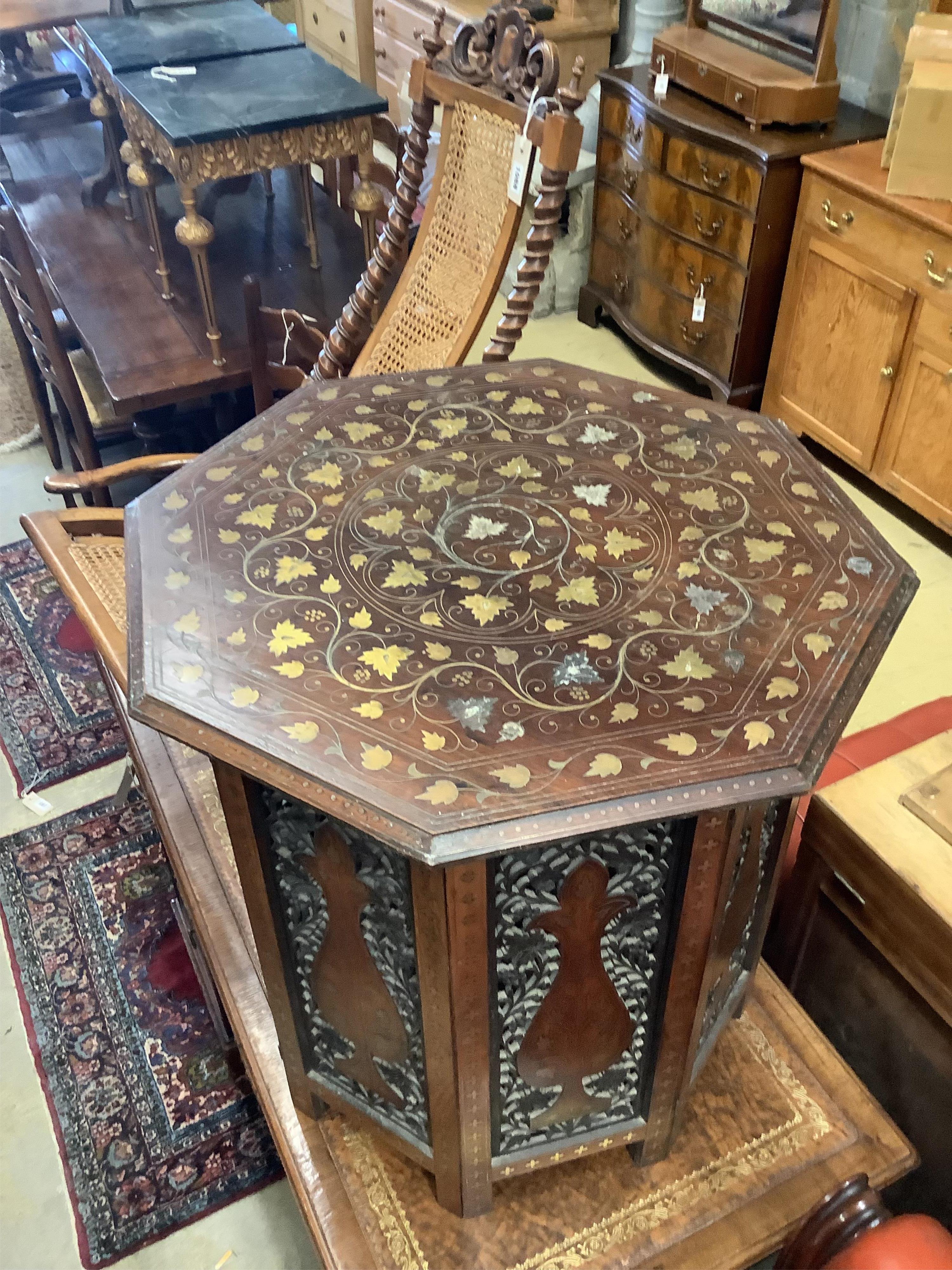An Anglo-Indian Moorish design octagonal brass-inlaid coffee table, width 61cm, height 64cm on folding stand together with a Victorian cane folding seat chair